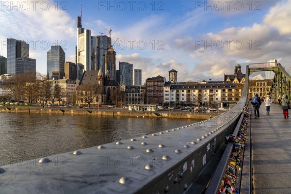 Skyline of the city centre of Frankfurt am Main, river Main, Eiserner Steg bridge, dusk, Hesse, Germany, Europe