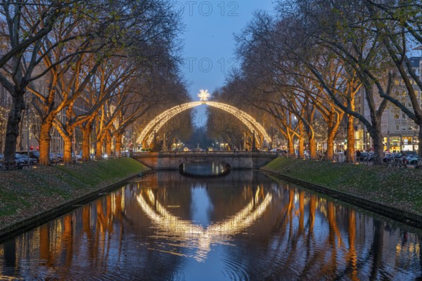 Königsallee, Kö, elegant shopping street in the city centre of Düsseldorf, arc of light over the city canal, Christmas time, North Rhine-Westphalia, Germany, Europe