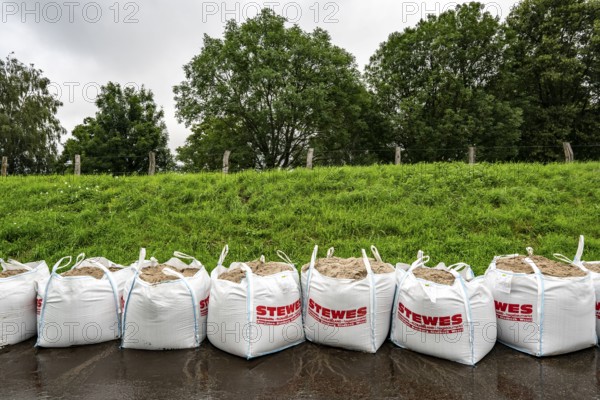 Ruhr floods near Mülheim-Menden, damage to the Ruhr dyke was sealed with large sand packs, flooded Ruhr floodplains, floods on the Ruhr, after long heavy rainfall the river left its bed and flooded the countryside and villages, the highest water level ever measured, North Rhine-Westphalia, Germany, Europe