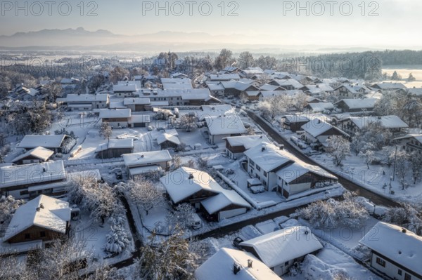 A snow-covered village in a wintry landscape with a blue-white sky and a peaceful atmosphere, Kleinhöhenrain, Beautiful view