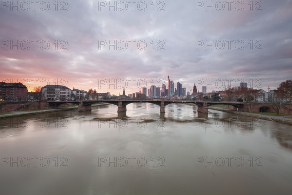 Frankfurt am Main. Beautiful sunset on the bridge over the Main with a view of the Frankfurt skyline
