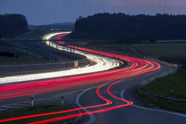 Tracers on the A8 motorway, winding road, evening, long exposure, Swabian Alb, Baden-Württemberg, Germany, Europe