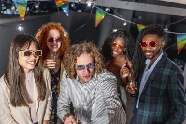 Diverse friends with elegant clothes and sunglasses taking selfie together drinking champagne in a night party at terrace