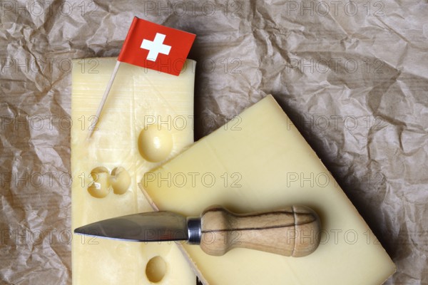 A piece of Swiss Emmental cheese and the Swiss flag