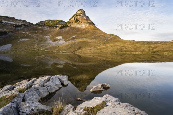 Lake Augstsee and the Atterkogel mountain on the Loser. Autumn, good weather, blue sky, little clouds. In the evening. Reflection. Altaussee, Bad Aussee, Ausseer Land, Totes Gebirge, Styria, Upper Austria, Austria, Europe