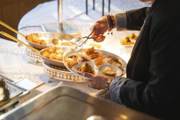 One person fills their plate with a selection of delicious buffet dishes, Europäischer Hof, Königsbach Stein, Germany, Europe