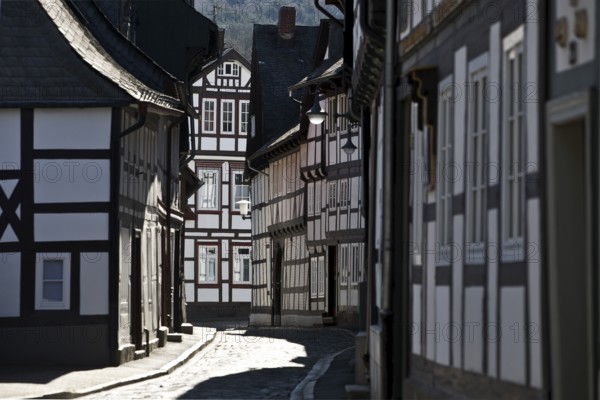 Narrow alley with half-timbered houses and cobblestones in the old town, UNESCO World Heritage Site, Goslar, Lower Saxony, Germany, Europe