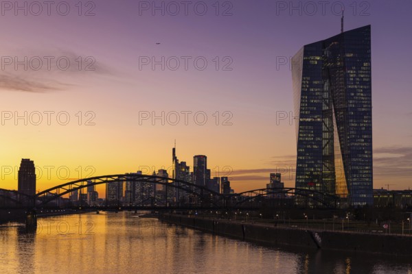 Shortly after sunset, the lights in the offices of the European Central Bank (ECB) and the Frankfurt banking skyline begin to glow, Frankfurt am Main, Osthafen, Hesse, Germany, Europe