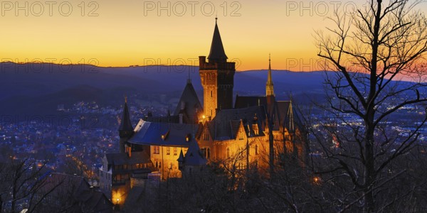 Atmospheric view of the illuminated Wernigerode Castle at sunset, Harz Mountains, Saxony-Anhalt, Germany, Europe