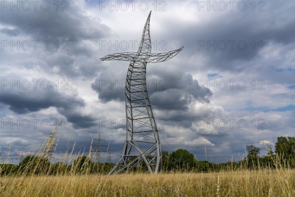 Emscherkunst, artwork Zauberlehrling by the Berlin artist group Inges Idee, an apparently dancing electricity pylon, 35 metres high, in a meadow near Haus Ripshorst in Oberhausen, North Rhine-Westphalia, Germany, Europe