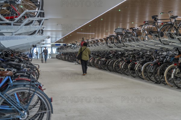 New bicycle car park at Amsterdam Central Station, IJboulevard, space for around 4000 bicycles, digitally monitored, underground, direct connection to the station, built into the water of the IJ, at the back of the station, Netherlands