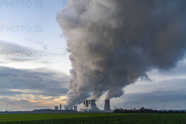 Neurath lignite-fired power plant, near Grevenbroich, power plant units F and G, A-E, thick water vapour cloud from the cooling towers in winter, near Grevenbroich, running until 2024 to secure energy supply, North Rhine-Westphalia, Germany, Europe
