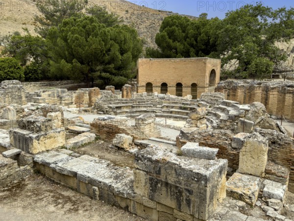 View of ruins of historic Roman amphitheatre from antiquity in excavation site remains of ancient Roman city of Gortys Gortyn former capital of Crete, Gortyna, Crete, Greece, Europe
