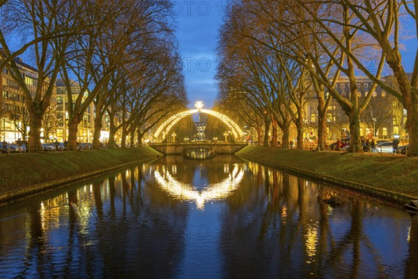 Christmas market, on Königsallee, Kö, Stadtgraben pond, Christmas lights, in the city centre of Düsseldorf, North Rhine-Westphalia, Germany, Europe