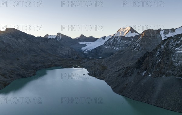 Mountain panorama, aerial view, 4000 metre peak with glacier, mountain pass and mountain lake Ala-Kul Lake, Tien Shan, Kyrgyzstan, Asia