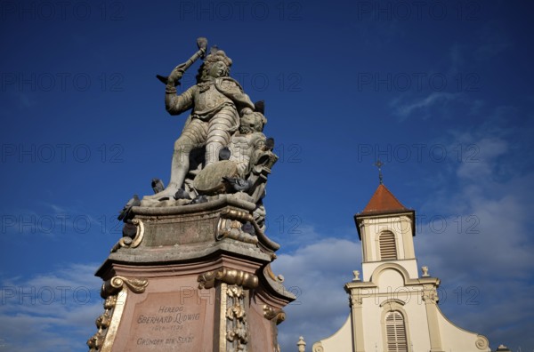Duke Eberhard Ludwig Monument, behind it the Catholic Church of the Most Holy Trinity, Ludwigsburg, Baden-Württemberg, Germany, Europe