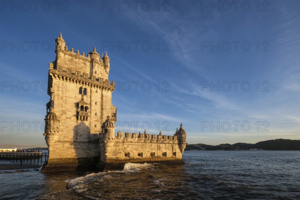 Belem Tower or Tower of St Vincent, famous tourist landmark of Lisboa and tourism attraction, on the bank of the Tagus River Tejo on sunset. Lisbon, Portugal, Europe
