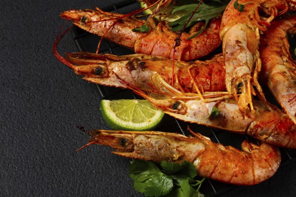 Langoustines, Australian, freshly frozen on ice, top view, lime and greens