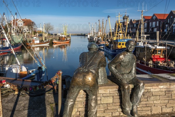 The harbour of Neuharlingersiel, East Frisia, Lower Saxony, fishing boats, fishing cutter, monument, Neuharlingersiel, Federal Republic of Germany ferry port