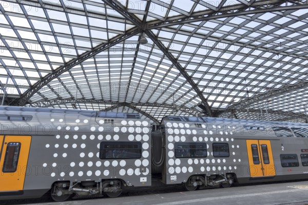 Local train and glass roof at Cologne Central Station, Cologne, Rhineland, North Rhine-Westphalia, Germany, Europe