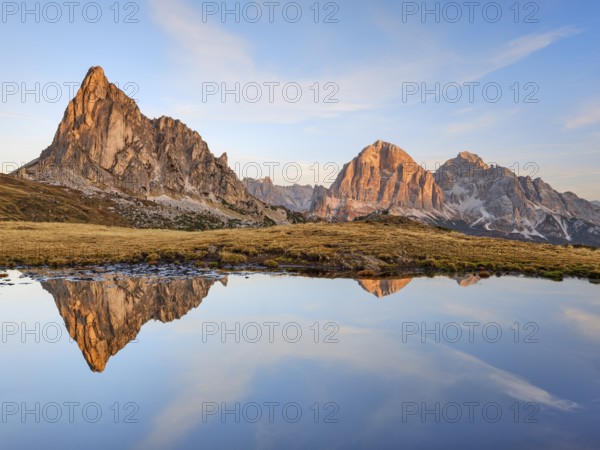 Ra Gusela in autumn, reflection, sunrise, blue sky, Passo di Giau, Dolomites, Belluno, Italy, Europe