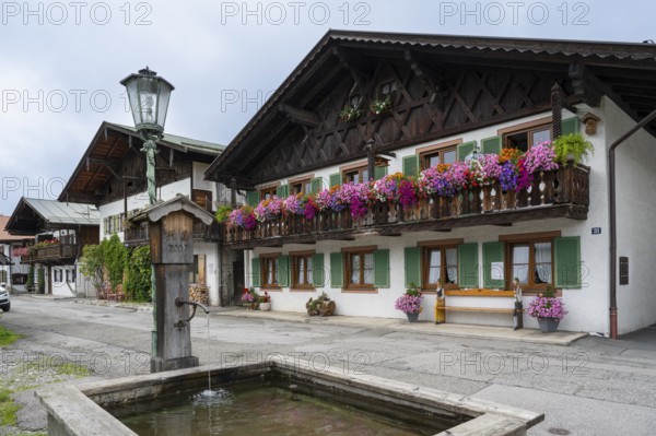 Typical Bavarian houses, balconies with geraniums, Frühlingstraße, Garmisch, Garmisch-Partenkirchen, Upper Bavaria, Bavaria, Germany, Europe