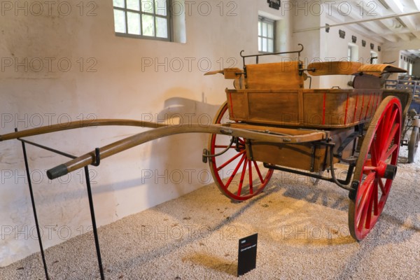 Historic wooden carriage with red wheels in a museum exhibition room, Tonneau carriage of the governess, 1880, Gallery of carriages, Chenonceau Castle, Château de Chenonceau, moated castle, Chenonceaux, Indre-et-Loire, Centre-Val de Loire, France, Europe