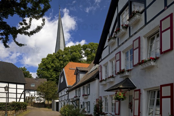 The old town centre with half-timbered houses and the church tower of Sankt Viktor, Schwerte, Ruhr area, North Rhine-Westphalia, Germany, Europe