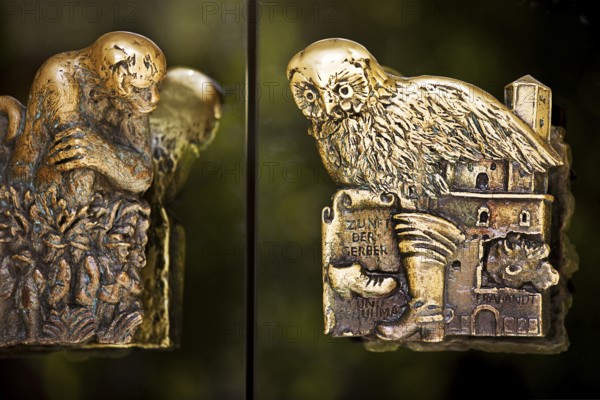 Door handles on the glass doors of the town hall with motifs from the history of the city of Braunschweig, Lower Saxony, Germany, Europe