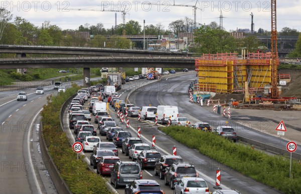 Duisburg, North Rhine-Westphalia, Germany, traffic jam on the A40 motorway at the Kaiserberg junction. The busy area with the A40 and A3 motorways has been undergoing renovation and expansion for years. There are always closures or restrictions for motorists there, Europe