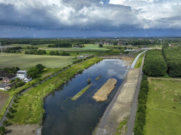 Dortmund / Castrop-Rauxel, North Rhine-Westphalia, Germany, river renaturalisation, renaturation of the Emscher, flood retention basin HRB Mengede. A new floodplain landscape is being created at the Emscher-Auen farm, expanding the area for flood protection during heavy rainfall and for biodiversity. The Emscher, which is currently straightened, will be given curves again and can meander through its new floodplain. Following the construction of a parallel sewer, the Emscher has been completely free of wastewater since 2022. The river was previously an open, above-ground combined sewer with rainwater and wastewater, Europe