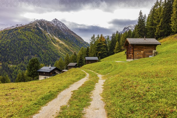 Alpine huts above Grimentz, behind the summit of Corne de Sorebois, Val d'Anniviers, Valais Alps, Canton Valais, Switzerland, Europe
