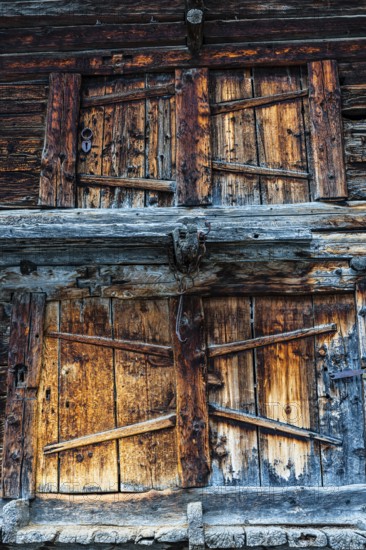 Weathered loading doors of an old hay barn, Grimentz, Val d'Anniviers, Valais Alps, Canton Valais, Switzerland, Europe
