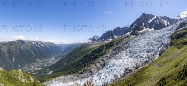 Panorama, mountain landscape with glacier Glacier des Bossons and summit of the Aiguille du Midi, view into the valley with the village of Chamonix, Chamonix, Haute-Savoie, France, Europe