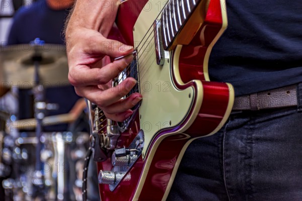 Guitarist on stage playing his instrument during a show, Belo Horizonte, Minas Gerais, Brazil, South America