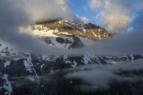 Cloudy mountain landscape in dramatic morning light, Griesferner peak with snow, Berliner Höhenweg, Zillertal, Tyrol, Austria, Europe