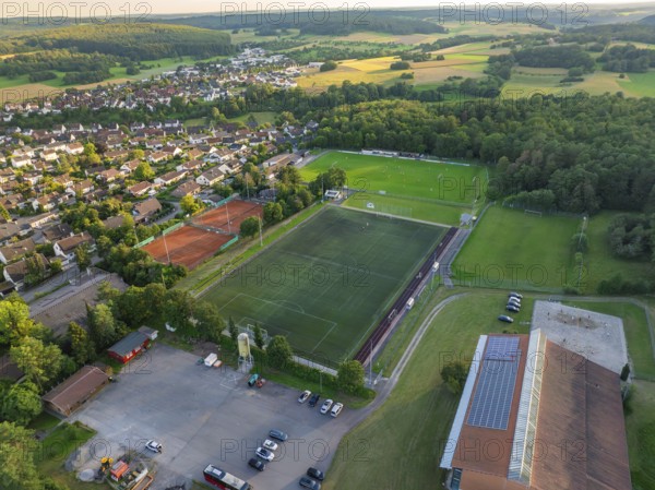 Aerial view of a village with a large sports field, football pitches and tennis courts, Gechingen, Black Forest, Germany, Europe