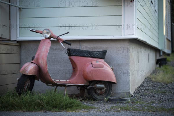 Pink-coloured Vespa in front of a house wall, Naantali or Nådendal, Baltic Sea coast, Finland, Europe