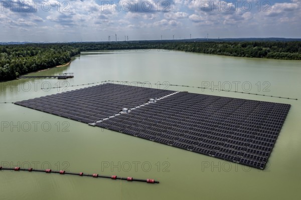 Germany's largest floating solar power plant on the Silbersee III, a quarry pond no longer used for sand mining, near Haltern am See, operated by Quarzwerke GmbH, around 5800 solar modules, on an area of a good 2 football pitches, generate 3.1 megawatts of power, the company uses the electricity itself on weekdays, at weekends it flows into the public grid, North Rhine-Westphalia, Germany, Europe