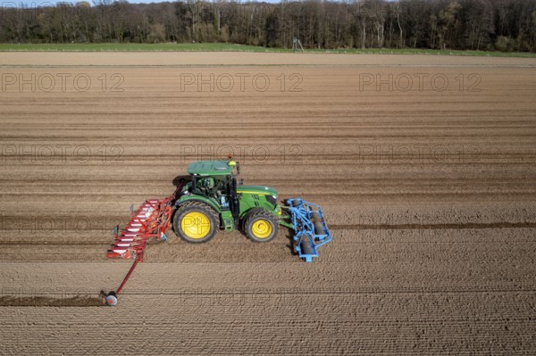 Sugar beet being sown in spring, precision sowing with precision seed drill, behind a tractor, Niederkrüchten, North Rhine-Westphalia, Germany, Europe