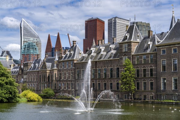 The historic Binnenhof, seat of the Dutch government, Hofvijver pond, skyline of the city centre at the central station, in the city centre of The Hague, Netherlands