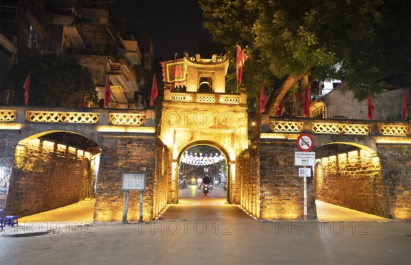 Illuminated old town gate at night, Hanoi, Vietnam, Asia