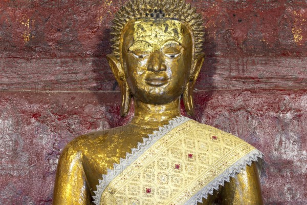 Golden Buddha statue, Bhumispara-mudra, Buddha Gautama at the moment of enlightenment, Wat Long Koon, Luang Prabang, Laos, Asia