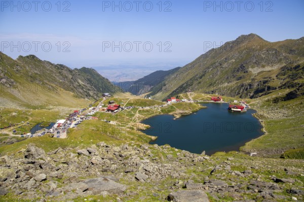 Romania: Lake Balea (Romanian: Balea Lac) from above. The lake is located at the summit of the Transfogarasch High Road in the Fogarasch Mountains on the border between Transylvania and Wallachia and is a popular excursion destination