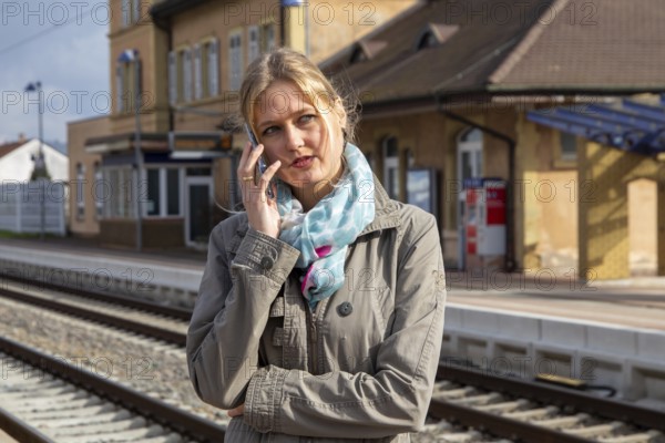 Young woman at a railway station in the provinces