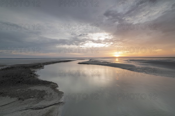 Sunrise off the monastery island of Mont Saint Michel in the Wadden Sea, Le Mont Saint Michel, Normandy, France, Europe