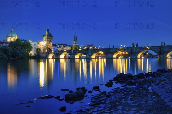 Charles Bridge (Karluv Most) on the Vltava River and Old Town Bridge Tower, at night, Prague, Czech Republic, Europe