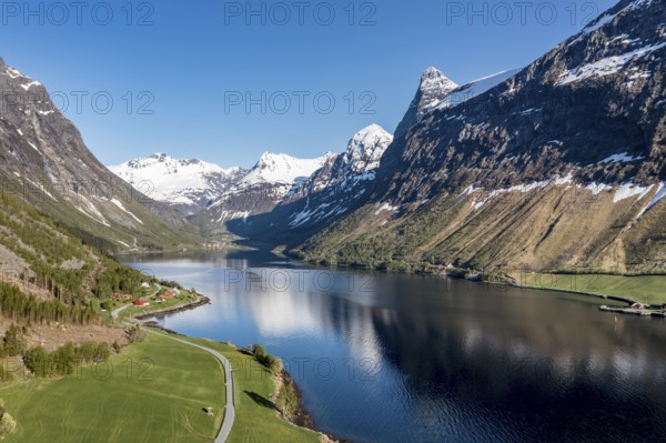 Panorama aerial view of fjord Hjørundfjord towards village Øye at end of fjord, Norway, Europe