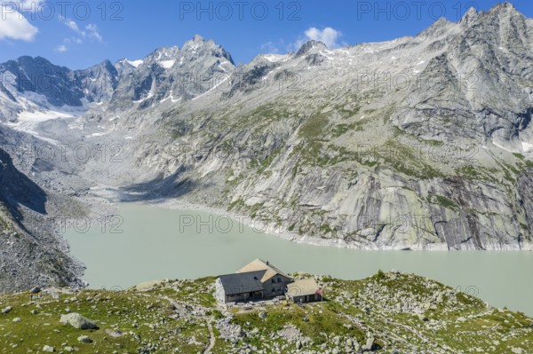 Capanna da l'Albigna, Albinga hut, above dam of reservoir Lake Albigna near village Vicosoprano, Bergell, Switzerland, Europe