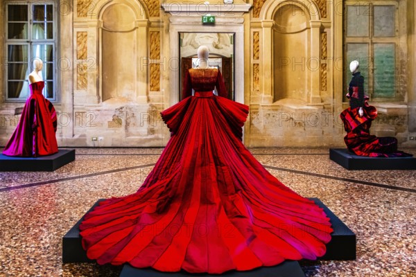 Red silk Mikado wedding dress in various shades of red with embroidered bodice, 2009, exhibition of magnificent evening dress creations by fashion designer Roberto Capucci, 17th century Villa Manin, residence of Ludovico Manin, Codroipo, Friuli, Italy, Codroipo, Friuli, Italy, Europe